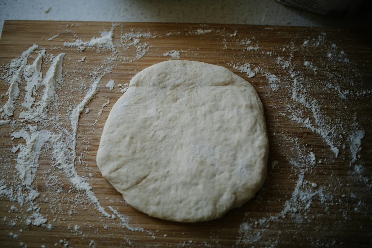 pizza dough on cutting board